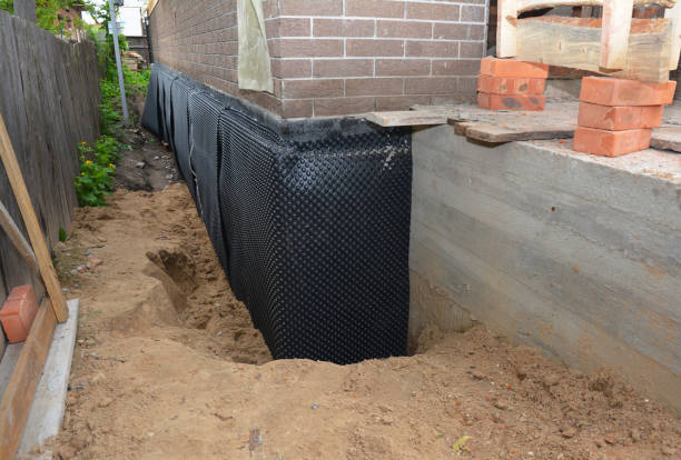 Happy homeowners after waterproofing job in Brookhaven